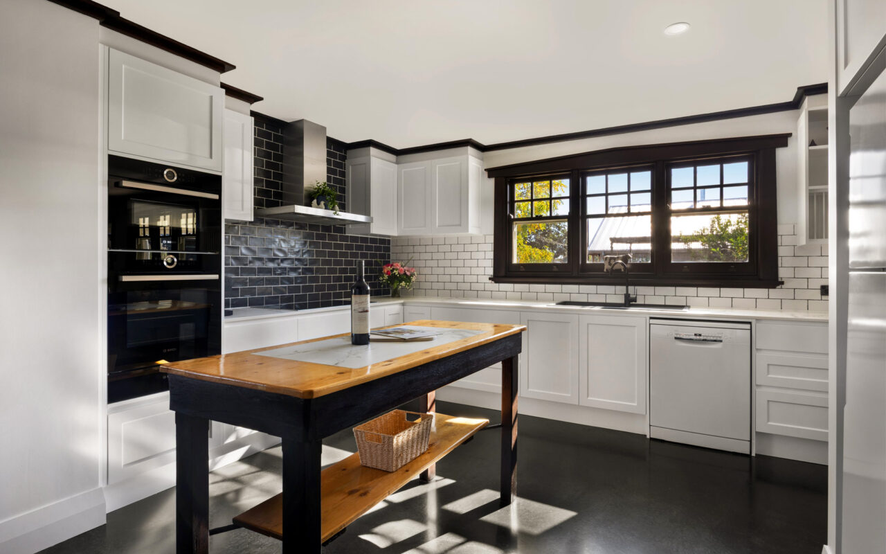 Modern farmhouse kitchen with large windows and premium appliances in Barossa luxury accommodation