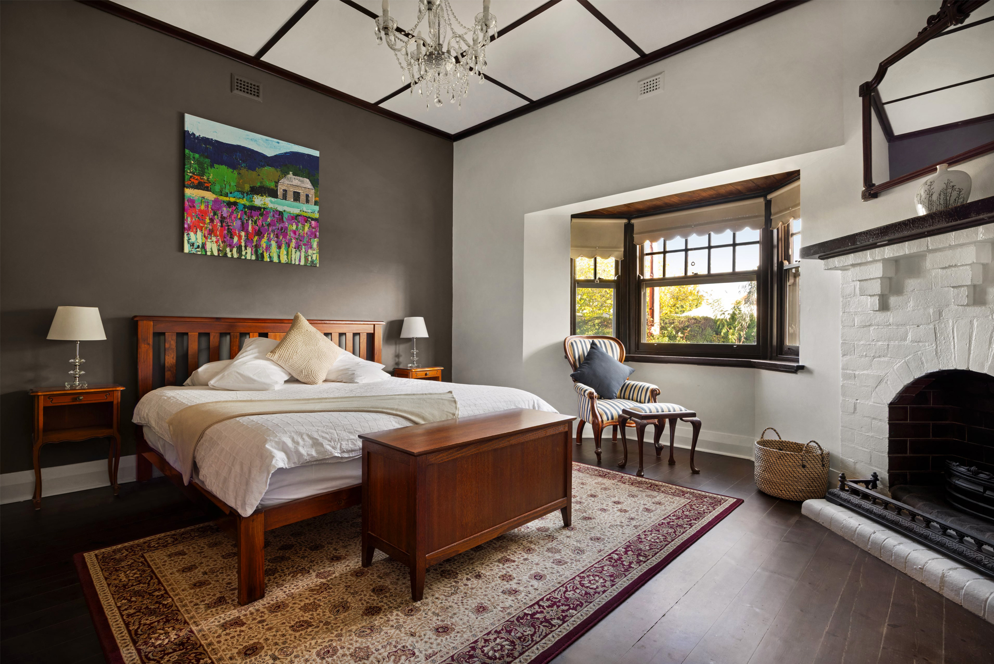Spacious master bedroom with fireplace and high ceilings in luxury Barossa Valley accommodation