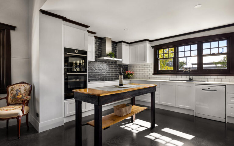 Modern farmhouse kitchen with large windows and premium appliances in Barossa luxury accommodation