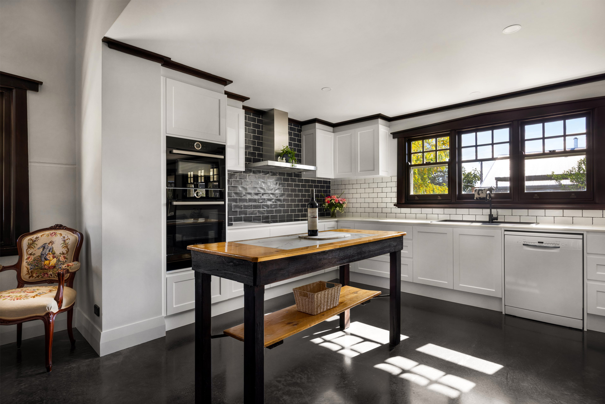 Modern farmhouse kitchen with large windows and premium appliances in Barossa luxury accommodation